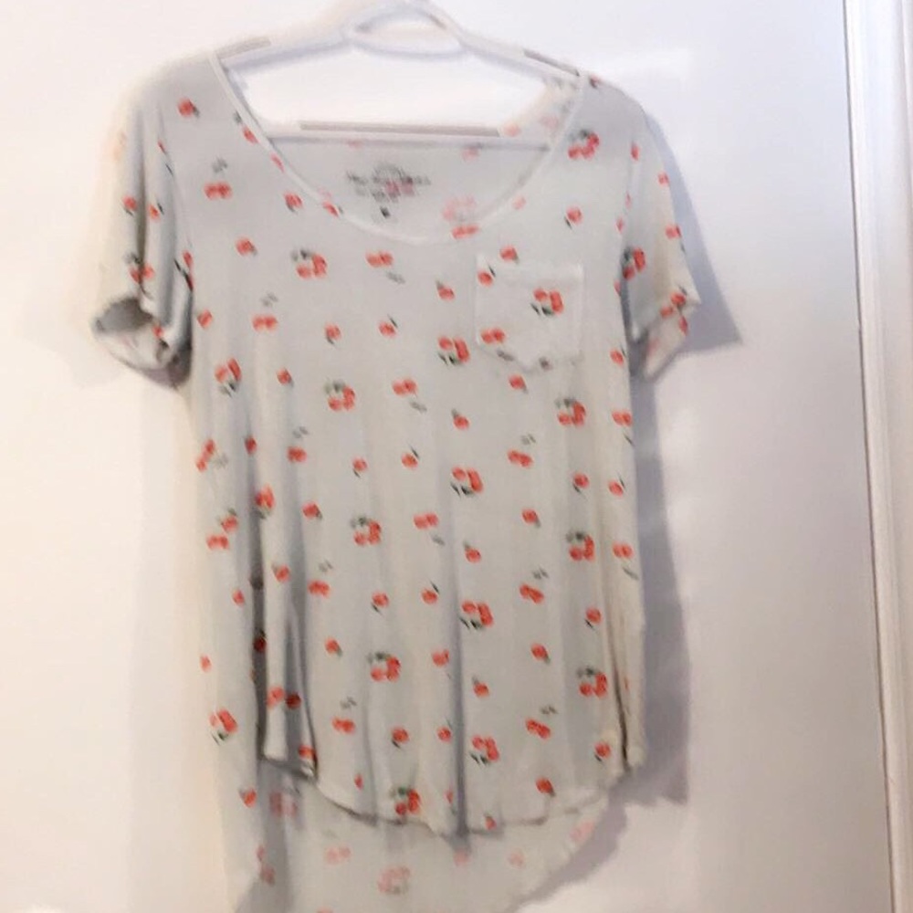 White shirt with red cherry’s on it